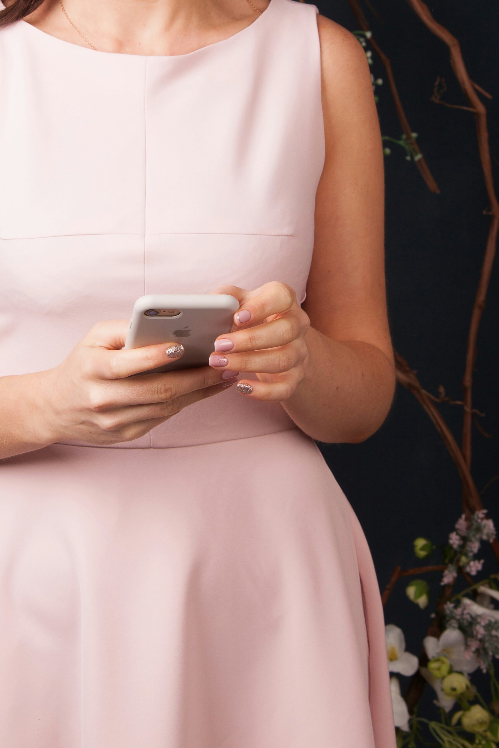 A real estate agent holding a phone, ready to assist with property inquiries and updates in Bateau Bay, Australia.